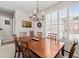 Dining room with a wood table, six chairs and a chandelier at 3782 Chattahoochee Summit Se Dr, Atlanta, GA 30339