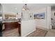 Open kitchen with wood cabinets, pendant lighting and wood-style flooring at 3782 Chattahoochee Summit Se Dr, Atlanta, GA 30339