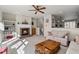 Living room features a brick fireplace, built in bookshelves, and ample natural light at 3782 Chattahoochee Summit Se Dr, Atlanta, GA 30339