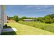 A spacious backyard with a manicured lawn and a fence at 300 Halibut Circle Cir, Covington, GA 30016