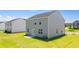 Spacious backyard featuring a lush lawn and the home's exterior at 300 Halibut Circle Cir, Covington, GA 30016