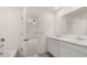 Bright bathroom with a double sink vanity, large mirror, and doorway leading to a bedroom at 300 Halibut Circle Cir, Covington, GA 30016