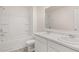 Bright bathroom featuring double sinks, white cabinets, and a tub-shower combo at 300 Halibut Circle Cir, Covington, GA 30016