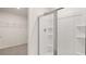 Modern bathroom featuring a glass-enclosed shower with built-in shelving at 300 Halibut Circle Cir, Covington, GA 30016