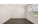 Empty bedroom with vinyl plank flooring and a window at 300 Halibut Circle Cir, Covington, GA 30016