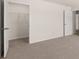 Bedroom features neutral carpet and a large open closet with wire shelving at 300 Halibut Circle Cir, Covington, GA 30016