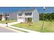 View of new construction home with brick and siding, green lawn, and sidewalks at 300 Halibut Circle Cir, Covington, GA 30016