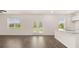 Bright living space with granite counters, hardwood floors, and exterior views at 300 Halibut Circle Cir, Covington, GA 30016