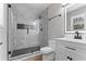 This remodeled bathroom features a glass-enclosed shower with modern tile at 6058 Ledgewood Dr, Forest Park, GA 30297
