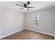 Bright bedroom with modern ceiling fan and hardwood floors at 6058 Ledgewood Dr, Forest Park, GA 30297