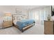 Well-lit bedroom featuring stylish decor, drapery, and lamps at 1977 American Way # 30, Kennesaw, GA 30144