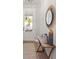 Stylish entryway with a decorative mirror and a wooden console table at 1977 American Way # 30, Kennesaw, GA 30144