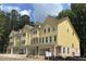Modern townhome with bright siding, multiple windows, and attached garage, offering comfort and convenience at 1977 American Way # 30, Kennesaw, GA 30144
