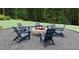 Inviting outdoor space featuring a cozy fire pit surrounded by comfortable Adirondack chairs at 1977 American Way # 30, Kennesaw, GA 30144