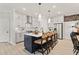 Modern kitchen with an island, stainless steel appliances, and stylish pendant lighting at 1977 American Way # 30, Kennesaw, GA 30144