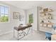 Home office with floating shelves, decor, natural light, and contemporary furniture at 1977 American Way # 30, Kennesaw, GA 30144