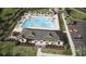 Aerial view of a luxurious community pool with ample seating and shaded areas for relaxation and recreation at 8597 Secretariat Dr, Lithonia, GA 30058