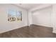 Living room boasting modern flooring and bright natural light from large window at 8597 Secretariat Dr, Lithonia, GA 30058