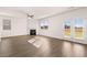 Living room featuring a fireplace, hardwood floors, and natural light at 8597 Secretariat Dr, Lithonia, GA 30058
