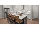 Bright kitchen with stainless steel appliances, large island and seating at 1983 American Way # 27, Kennesaw, GA 30144