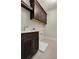 Laundry room with dark cabinets, sink, and tile flooring offers a functional and stylish space at 1983 American Way # 27, Kennesaw, GA 30144