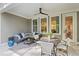 Covered patio with comfortable seating and outdoor dining provides a relaxing and stylish entertainment area at 1983 American Way # 27, Kennesaw, GA 30144