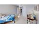 This bedroom features a comfortable bed, a spacious closet, and a desk for studying or working at 1181 Church St # G, Decatur, GA 30030