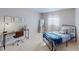 This bedroom features a comfortable bed, a nice mirror, and a desk for studying or working at 1181 Church St # G, Decatur, GA 30030
