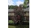 Brick exterior elevation surrounded by mature trees and flowering shrubs, a charming and well-maintained community at 1181 Church St # G, Decatur, GA 30030