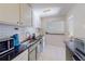 Well-lit kitchen with stainless steel appliances, white subway tile, and functional design at 1181 Church St # G, Decatur, GA 30030