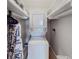 This closet features a stackable washer and dryer unit at 1181 Church St # G, Decatur, GA 30030