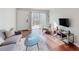 Bright living room with sliding glass doors, hardwood floors, and a comfortable seating area at 1181 Church St # G, Decatur, GA 30030