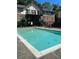 Community pool offers a refreshing escape on warm days, surrounded by a fenced outdoor area at 1181 Church St # G, Decatur, GA 30030