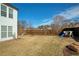Spacious backyard featuring a playset, sandbox, and a well-maintained lawn with a sturdy fence at 301 Ridgewood Trl, Canton, GA 30115