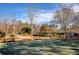 Community basketball court with picnic benches, landscaping and recreational amenities at 301 Ridgewood Trl, Canton, GA 30115