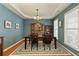 Dining room with hardwood floors, trey ceiling, decorative rug, and large picture windows at 301 Ridgewood Trl, Canton, GA 30115