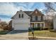 Charming two-story home with a manicured lawn, lovely landscaping, and a two car garage at 301 Ridgewood Trl, Canton, GA 30115