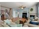 Comfortable living room with a fireplace, hardwood floors, and lots of natural light at 301 Ridgewood Trl, Canton, GA 30115