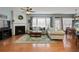 Cozy living room featuring a fireplace, neutral decor, hardwood floors, and ample natural light at 301 Ridgewood Trl, Canton, GA 30115