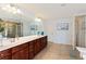 Spacious main bathroom with double sinks, a large mirror, and a separate shower at 301 Ridgewood Trl, Canton, GA 30115