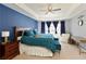Elegant main bedroom with a tray ceiling, a ceiling fan, and an abundance of natural light at 301 Ridgewood Trl, Canton, GA 30115