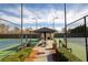 View of tennis courts with shaded seating area and manicured landscaping at 301 Ridgewood Trl, Canton, GA 30115