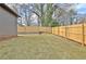 Large backyard with newly installed wooden fence and green grass at 3085 Jackson St, Hapeville, GA 30354