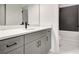 Bathroom with grey vanity, marble countertops, and subway tile in the shower at 3085 Jackson St, Hapeville, GA 30354