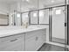Bathroom features quartz counters, gray cabinets, and glass shower at 3085 Jackson St, Hapeville, GA 30354