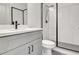 Stylish bathroom featuring tiled shower with glass, sleek vanity, and trendy fixtures at 3085 Jackson St, Hapeville, GA 30354