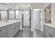 Modern bathroom features gray vanity, tile floors, and glass shower at 3085 Jackson St, Hapeville, GA 30354