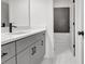 Bathroom with grey vanity, marble countertops, and subway tile in the shower at 3085 Jackson St, Hapeville, GA 30354
