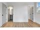 Bedroom featuring hardwood floors, doors leading to closet and bathroom at 3085 Jackson St, Hapeville, GA 30354