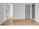 Spacious bedroom featuring wood-look floors, neutral paint and several doorways at 3085 Jackson St, Hapeville, GA 30354